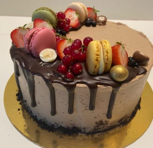 Berries and macarons chocolate cake