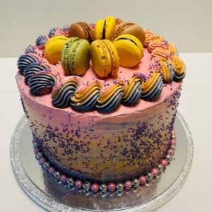 Colorful birthday cake with macarons